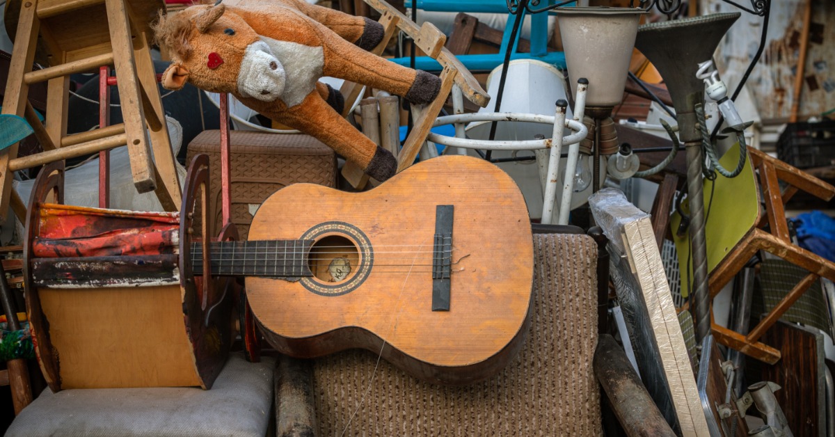 An assortment of vintage items in an uncared for state. They are all stacked on top of each other in a messy pile.